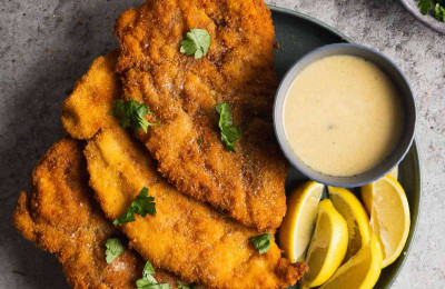 Chicken Schnitzel accompanied by Mango Cream Sauce