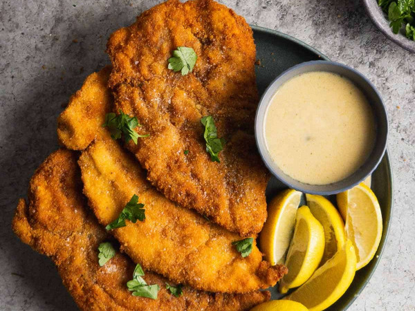 Chicken Schnitzel accompanied by Mango Cream Sauce