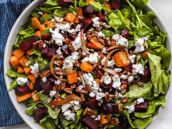 Salad Featuring Roasted Sweet Potatoes, Beet Noodles, Goat Cheese, and Pistachio Vinaigrette